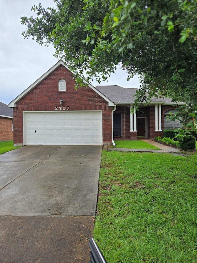 2727 N Larkspur Cir, Pearland, TX 77584 - single story home with concrete driveway, brick siding, a front lawn, and an attached garage