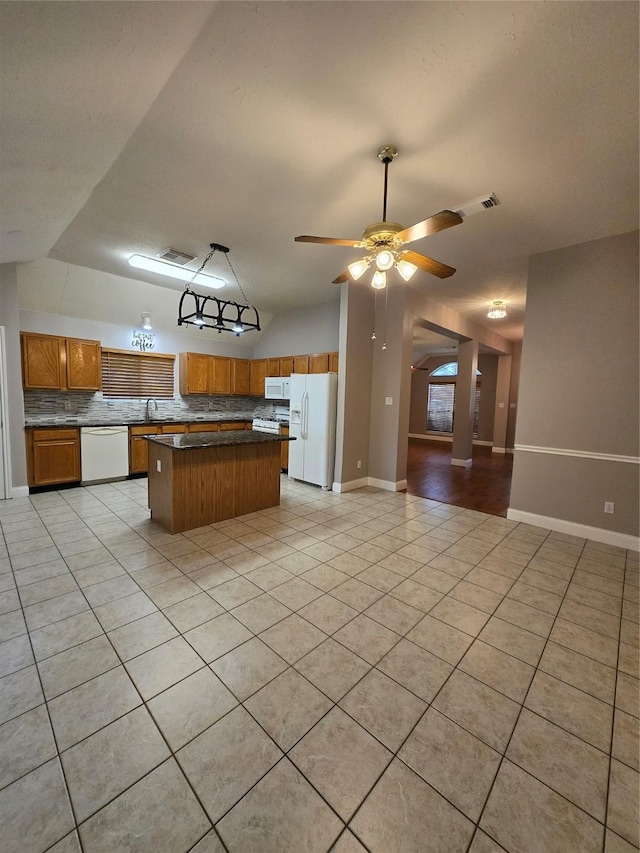 2727 N Larkspur Cir, Pearland, TX 77584 - kitchen with white appliances, tasteful backsplash, light tile patterned flooring, and open floor plan