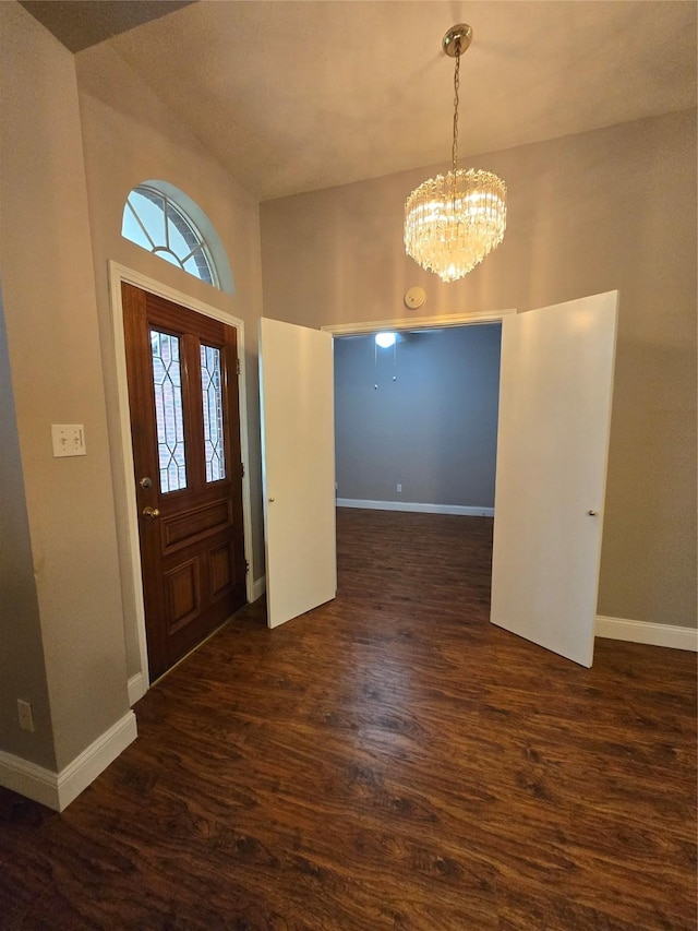 2727 N Larkspur Cir, Pearland, TX 77584 - entryway with dark wood-style flooring, a chandelier, and a towering ceiling
