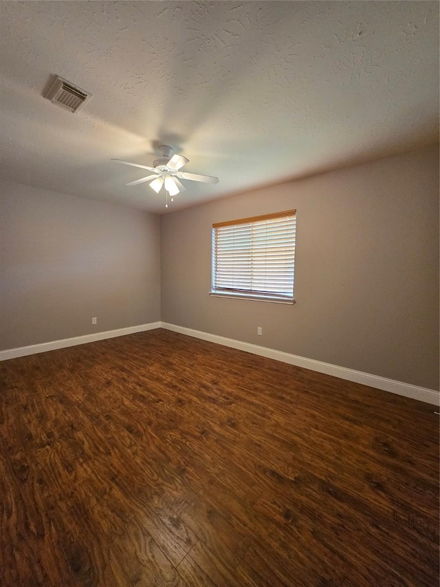 2727 N Larkspur Cir, Pearland, TX 77584 - spare room with ceiling fan, dark wood finished floors, and a textured ceiling