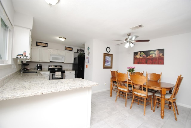 dining room with baseboards and a ceiling fan