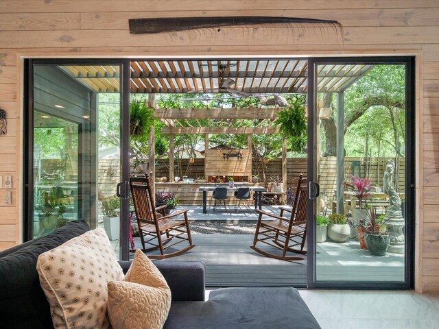doorway featuring wood walls