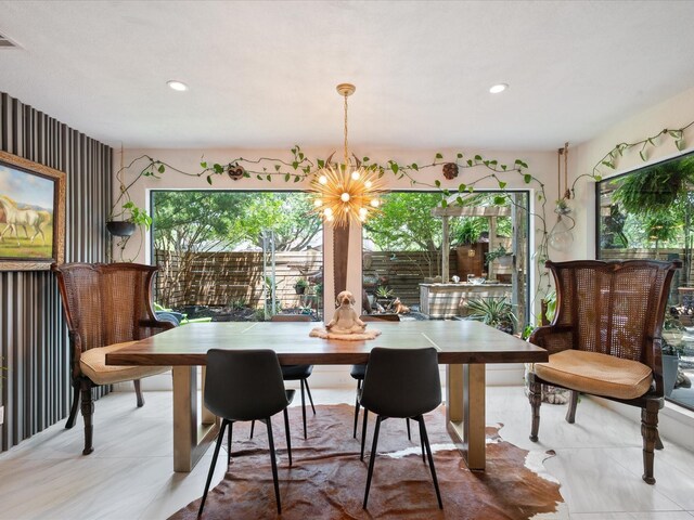 dining space with a chandelier and recessed lighting
