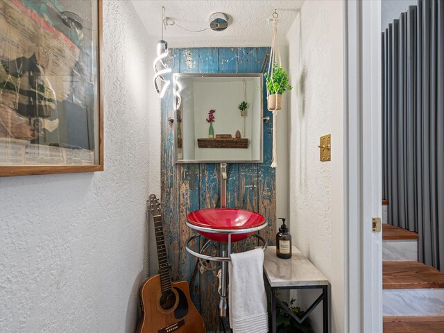 bathroom with a textured wall