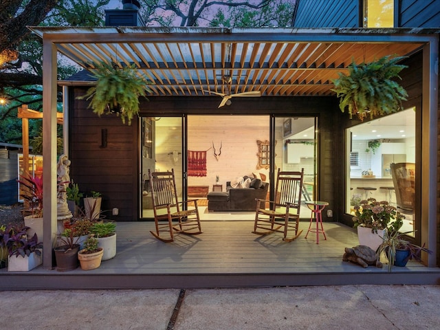 view of patio featuring a deck, an outdoor hangout area, and a pergola