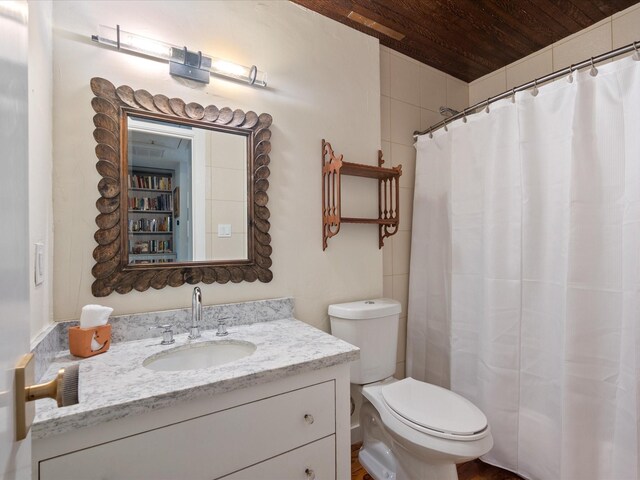 bathroom featuring wooden ceiling, toilet, vanity, and a shower with shower curtain