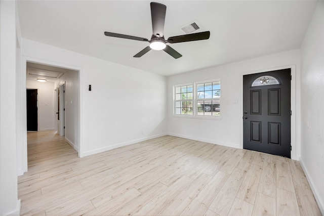 foyer with ceiling fan, wood finished floors, and baseboards