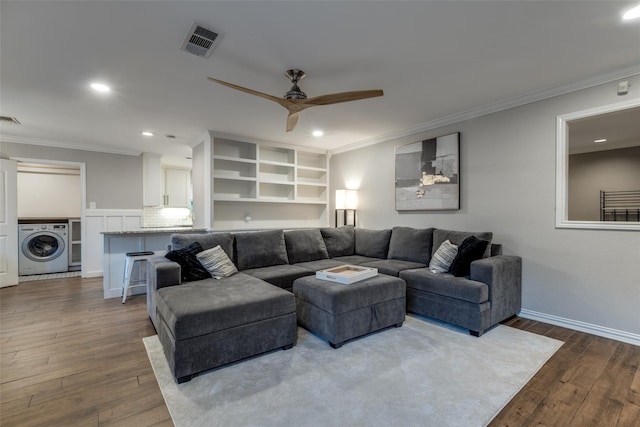 6031 Mcknight St, Houston, TX 77035 - living area featuring washer / dryer, dark wood-style floors, recessed lighting, ceiling fan, and ornamental molding