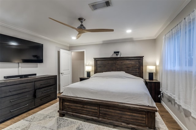 6031 Mcknight St, Houston, TX 77035 - bedroom with wood finished floors, a ceiling fan, crown molding, recessed lighting, and baseboards