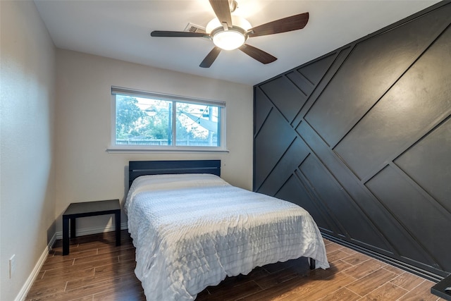 6031 Mcknight St, Houston, TX 77035 - bedroom with wood finished floors, ceiling fan, and baseboards
