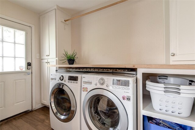 6031 Mcknight St, Houston, TX 77035 - laundry area featuring washer and clothes dryer, cabinet space, and dark wood-type flooring