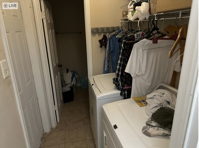 8979 Imogene St, Houston, TX 77036 - laundry room with independent washer and dryer and light tile patterned floors