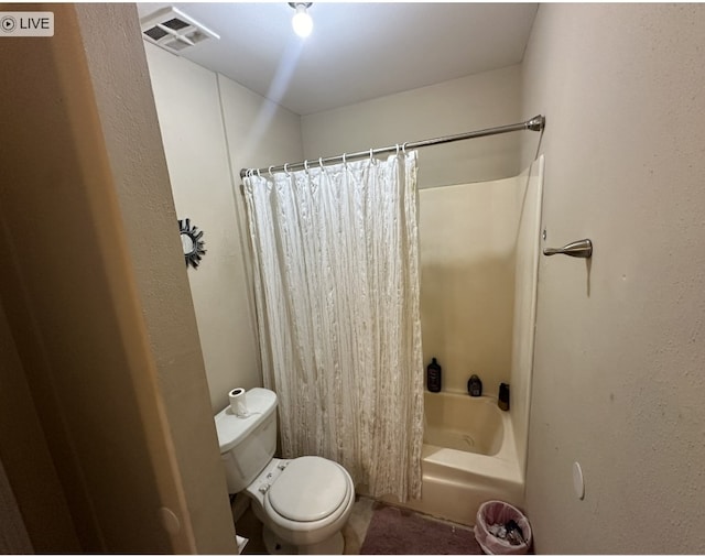 8979 Imogene St, Houston, TX 77036 - bathroom with toilet and shower / bath combination with curtain