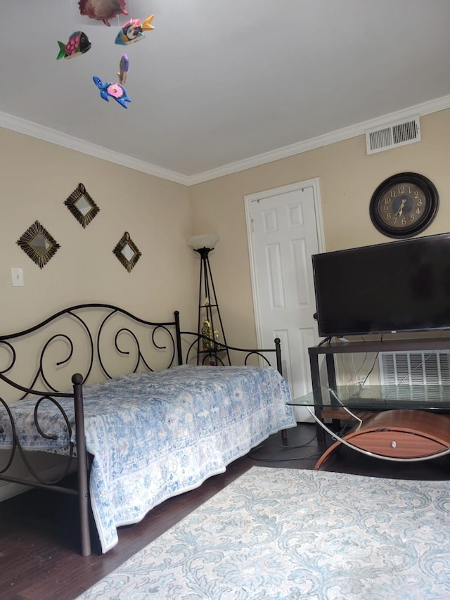 8979 Imogene St, Houston, TX 77036 - bedroom featuring ornamental molding and wood finished floors
