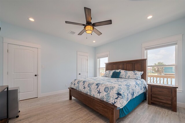 bedroom featuring light wood-style flooring, baseboards, recessed lighting, and a ceiling fan