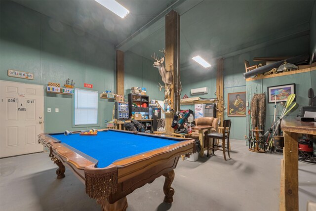 playroom featuring concrete floors, pool table, and a wall mounted air conditioner