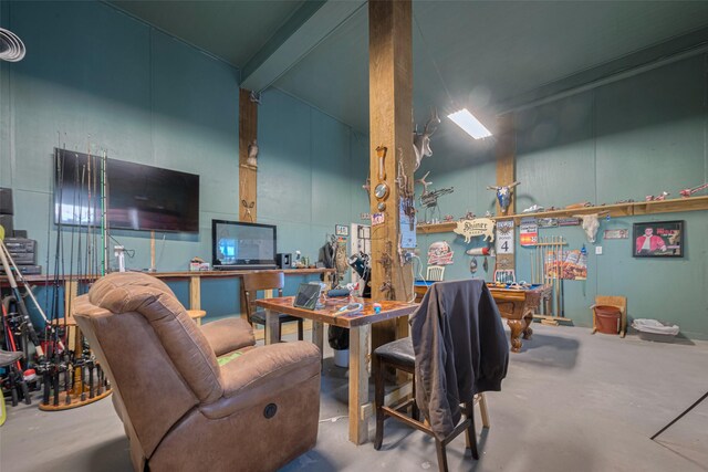 living area with concrete flooring, a workshop area, and billiards
