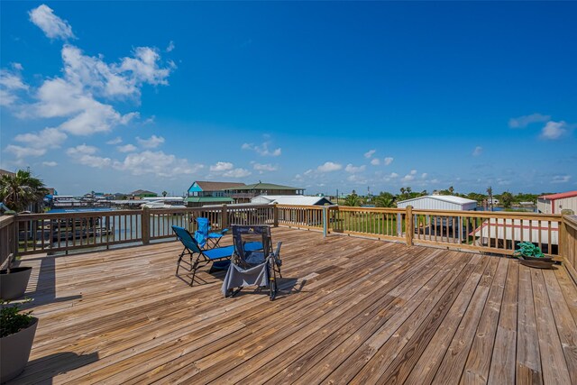 wooden deck featuring outdoor dining area