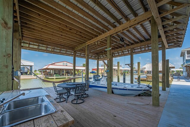 dock featuring a sink, boat lift, and a water view