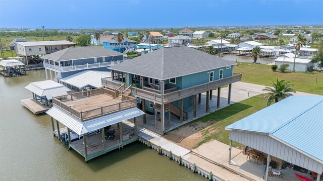 aerial perspective of suburban area with a nearby body of water