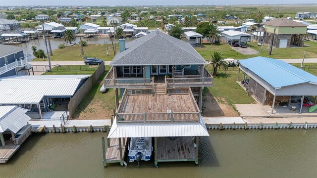 aerial view of residential area featuring a large body of water