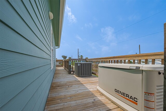 wooden deck with central air condition unit
