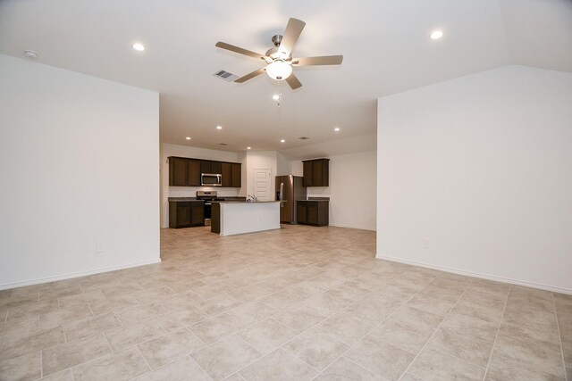 unfurnished living room featuring a ceiling fan, recessed lighting, and baseboards