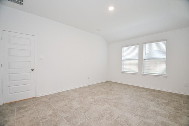 unfurnished room with lofted ceiling, recessed lighting, and baseboards