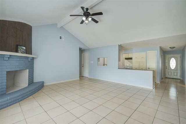 unfurnished living room with ceiling fan, a brick fireplace, light tile patterned flooring, and baseboards