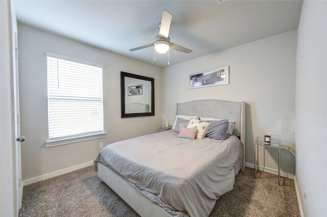 bedroom featuring carpet, baseboards, and a ceiling fan