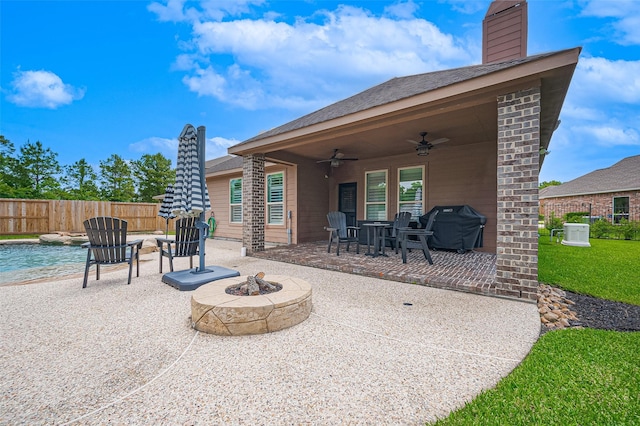 view of patio featuring a fire pit, a ceiling fan, fence, and central air condition unit