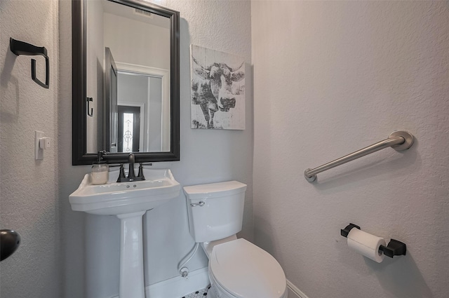 half bathroom with toilet