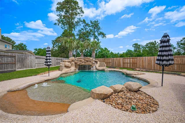 view of swimming pool featuring a fenced backyard and a patio