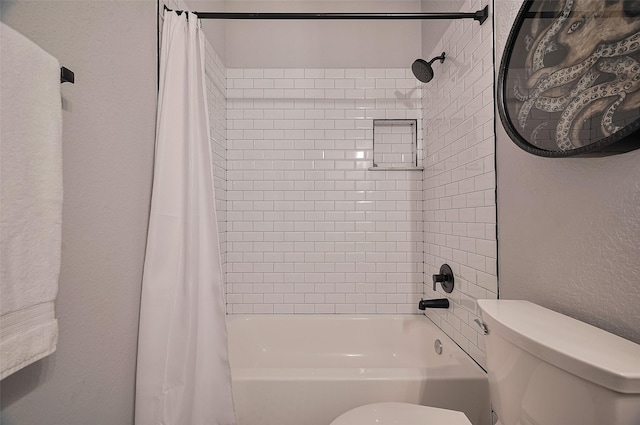full bath featuring toilet and shower / tub combo with curtain