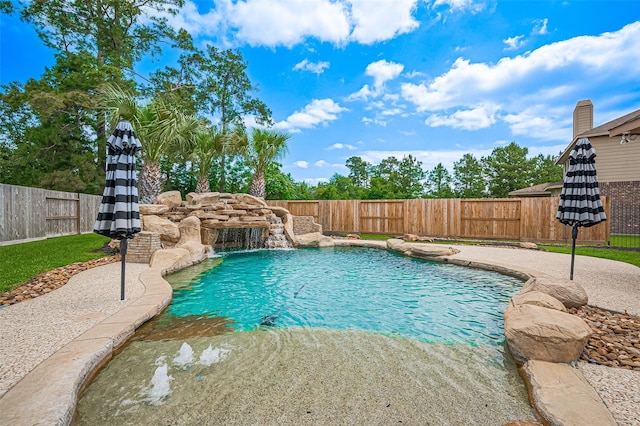 view of swimming pool with a fenced backyard and a patio area