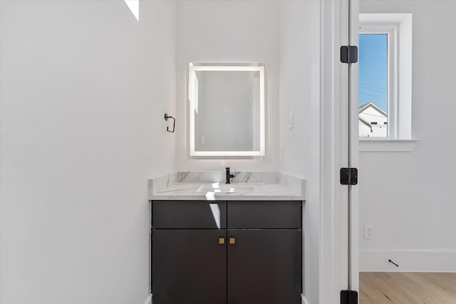 3912 Tulane St, Houston, TX 77018 - bathroom featuring wood finished floors, vanity, and baseboards