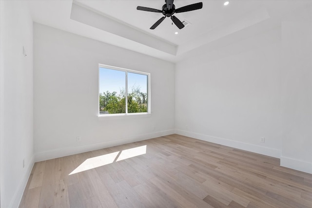 3912 Tulane St, Houston, TX 77018 - unfurnished room with baseboards, light wood finished floors, a raised ceiling, ceiling fan, and recessed lighting