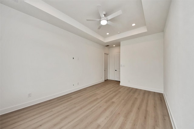 435 Neyland St, Houston, TX 77022 - spare room with light wood finished floors, ceiling fan, recessed lighting, and a raised ceiling