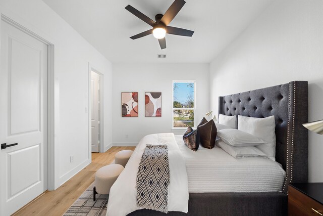 431 Neyland St, Houston, TX 77022 - bedroom with light wood-type flooring, baseboards, and a ceiling fan