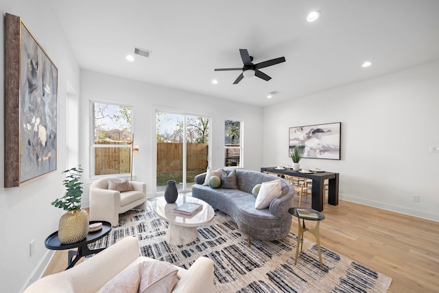 431 Neyland St, Houston, TX 77022 - living room with light wood-type flooring, plenty of natural light, ceiling fan, baseboards, and recessed lighting