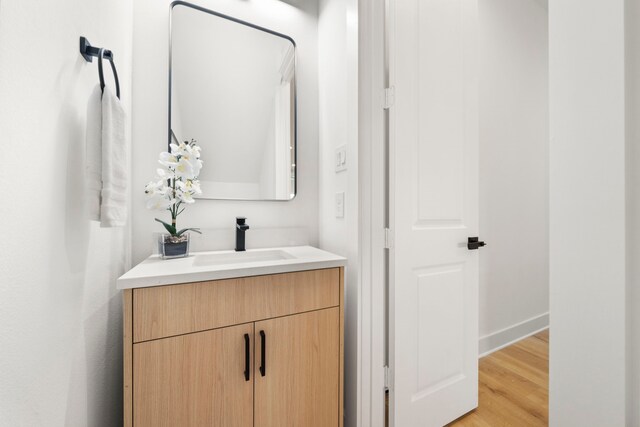 431 Neyland St, Houston, TX 77022 - bathroom with vanity, wood finished floors, and baseboards