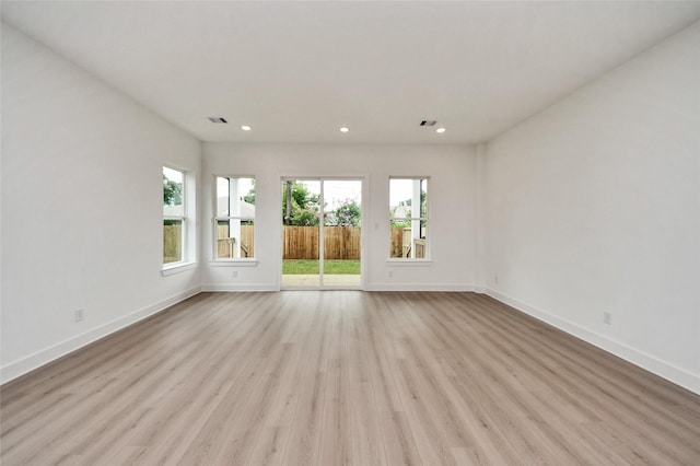 431 Neyland St, Houston, TX 77022 - spare room featuring wood finished floors and recessed lighting