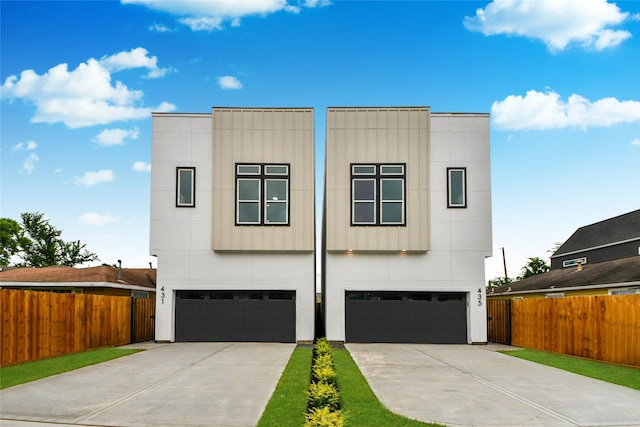 431 Neyland St, Houston, TX 77022 - contemporary house featuring an attached garage and concrete driveway