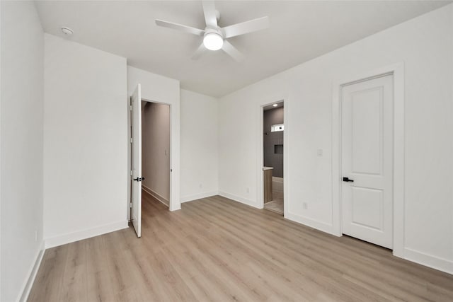 431 Neyland St, Houston, TX 77022 - unfurnished bedroom featuring light wood-style floors, ensuite bathroom, and a ceiling fan