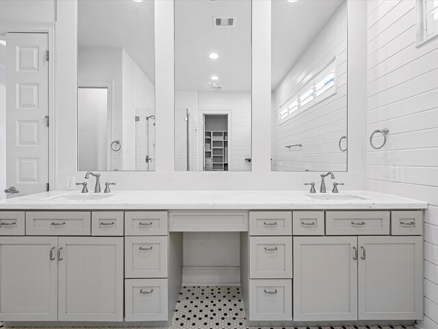 full bathroom with double vanity, tile patterned floors, and recessed lighting