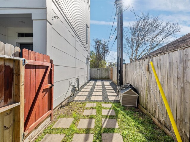 fenced backyard featuring a gate