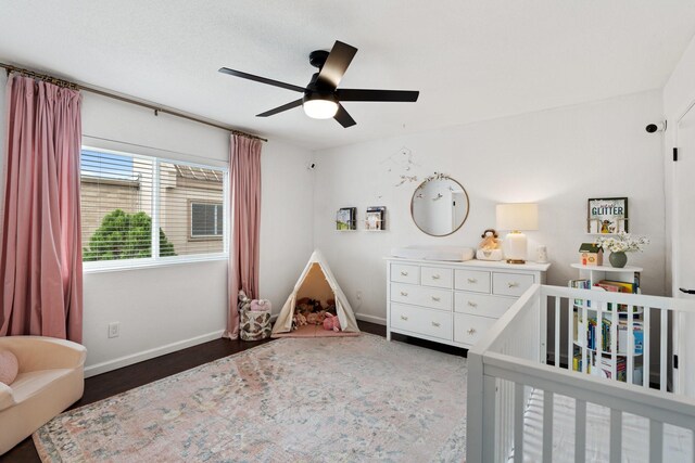 1115 Augusta Dr Unit 8, Houston, TX 77057 - bedroom with a nursery area, baseboards, wood finished floors, and ceiling fan