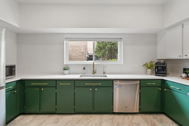 1115 Augusta Dr Unit 8, Houston, TX 77057 - kitchen with stainless steel appliances, a sink, light countertops, light marble finish floors, and white cabinets