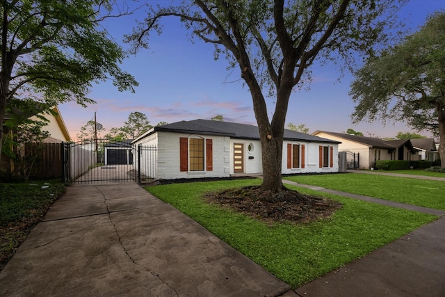 8902 Hendon Ln, Houston, TX 77036 - ranch-style home featuring a gate, brick siding, and concrete driveway