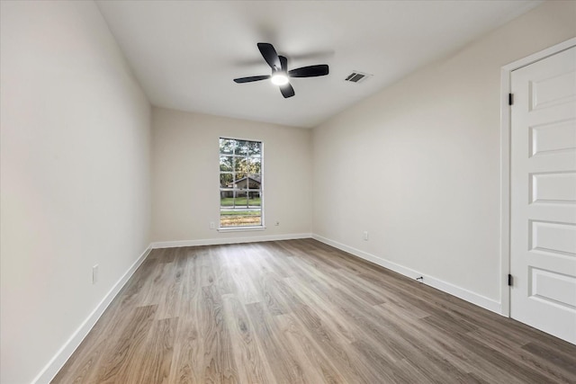 8902 Hendon Ln, Houston, TX 77036 - empty room with wood finished floors, ceiling fan, and baseboards
